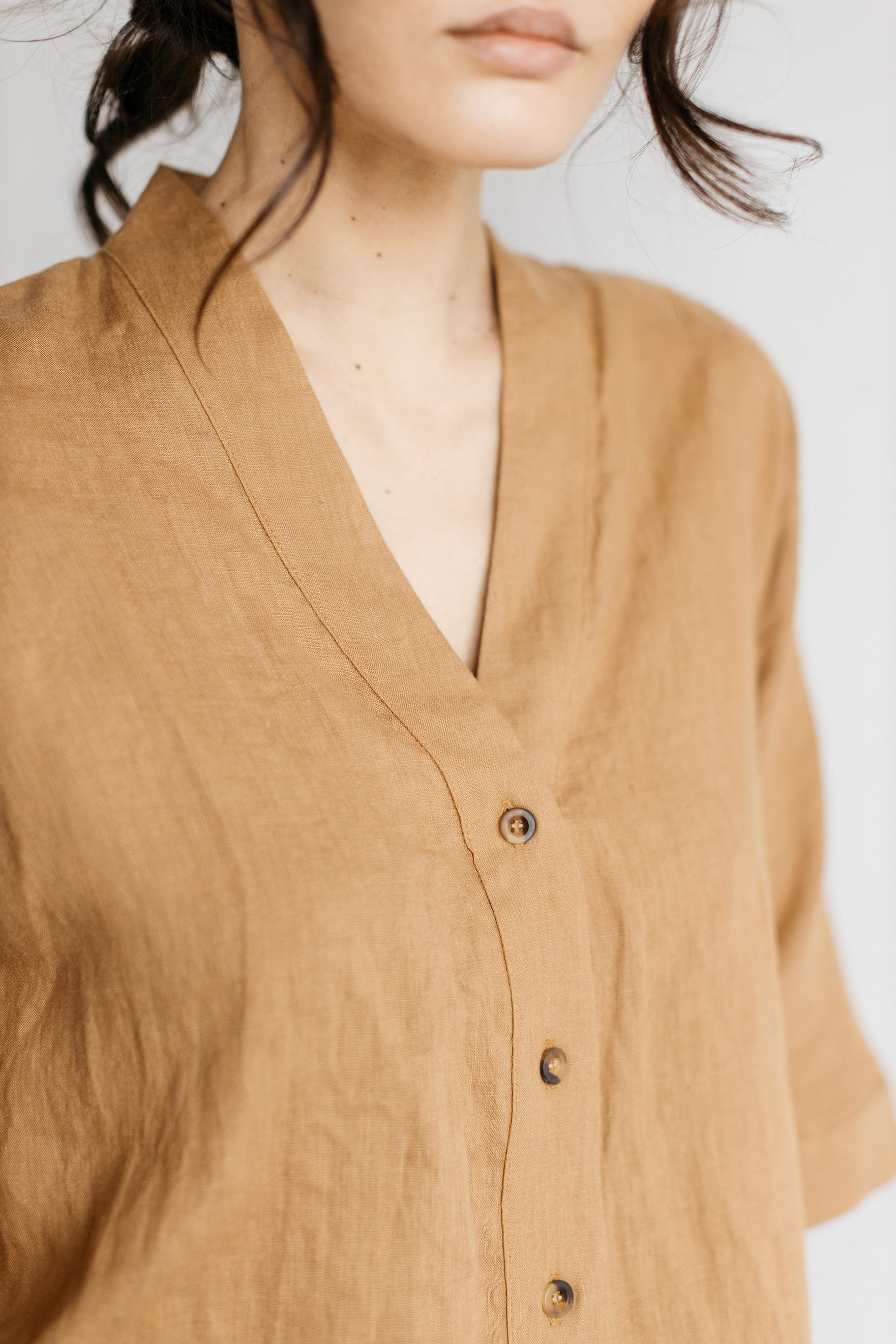 Three tortoise buttons at front